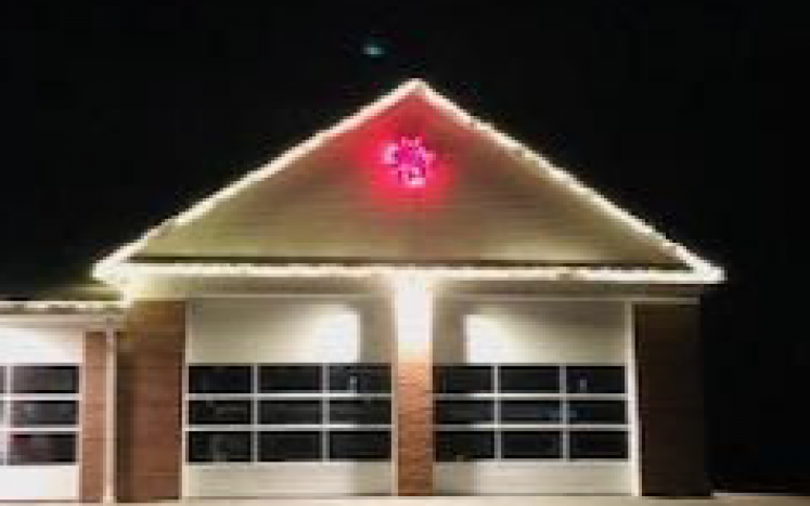 Photo of fire station with red wreath